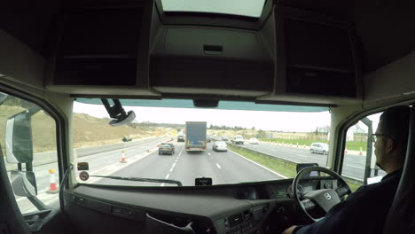 An-in-cab-lorry-view-of-junction-10A-on-the-M20-motorway-under-construction,-Ashford,-Kent