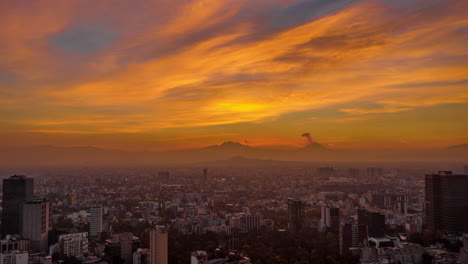 Aerial-hyperlapse-of-a-epic-sunrise-in-Mexico-City-with-a-big-explosion-of-the-active-volcano-Popocatepetl