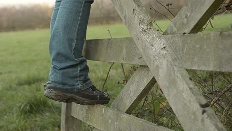 Muddy-boots-on-countryside-gate