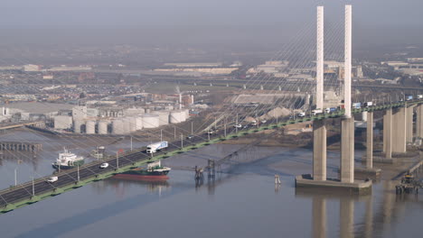 Aerial-view-tracking-flowing-traffic-on-the-QE2-Dartford-crossing-on-the-River-Thames,-Kent---Essex-England