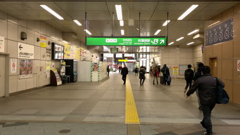 People-walk-inside-Central-gate-of-Akihabara-Station
