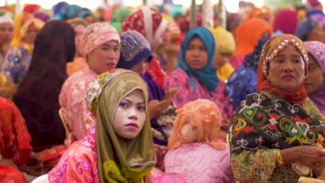 Crowds-of-women-dressed-in-bright-and-colorful-traditional-clothing-gather-in-the-Autonomous-Region-in-Muslim-Mindanao,-ARMM