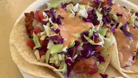 A-close-up-slow-motion-video-of-a-plate-of-fish-tacos-that-will-make-your-mouth-water