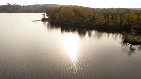 Aerial-view-of-lake-and-forest-with-autumn-colours