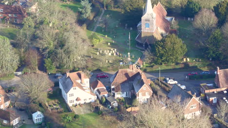 Aerial-view-of-houses-and-St-Mary's-church-in-High-Halden-village,-located-in-Kent-UK