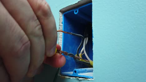 Connecting-wires-and-twisting-on-a-few-wire-nuts-for-a-light-switch-install