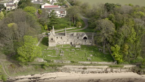 An-aerial-view-of-St-Bridgets-Kirk-ruin-on-the-banks-of-the-Firth-of-Forth,-Scotland