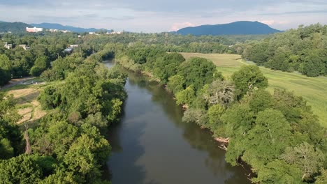 Aerial-footage-of-the-French-Broad-river-at-Carrier-Park-in-Asheville,-NC