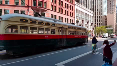 Shot-of-historic-Street-Car-passing-by-on-Market-Street-on-a-summer-day-in-San-Francisco,-California,-USA