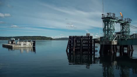 Time-lapse-of-the-Vashon-Island-ferry-docking-at-Pt-Defiance,-Tacoma-Washington-on-a-partly-cloudy-warm-spring-day