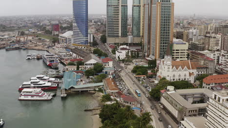 Bird's-eye-view-of-Dar-es-Salaam-downtown-port-area-with-office-administrative-buildings,-port-facilities-and-saint-Joseph-Cathedral