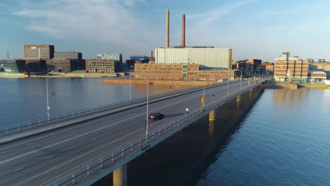 Tracking-aerial-shot-of-a-bridge-in-Helsinki-during-sunset