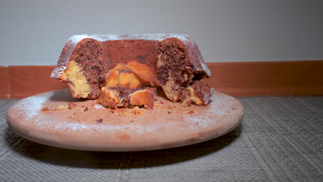 Traditional-marble-cake-on-wooden-plate,-sliding-dolly-shot,-close-up