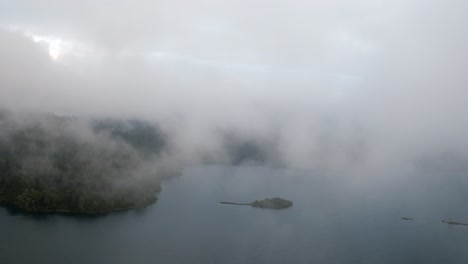 Aerial-revealing-shot-of-a-little-island-in-the-Tziscao-Lake,-Chiapas