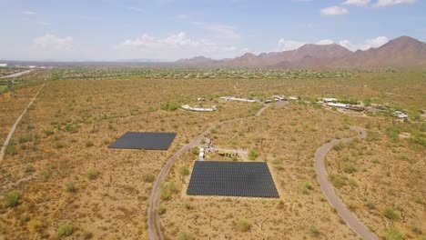 Aerial-rotation-on-an-array-of-solar-panels-in-the-Sonoran-desert-near-Taliesin-West,-Scottsdale,-Arizona