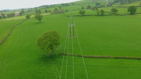 aerial-shot-of-a-line-of-new-power-lines-erected-to-support-the-new-clocaneog-onshore-wind-farm-project-in-north-wales