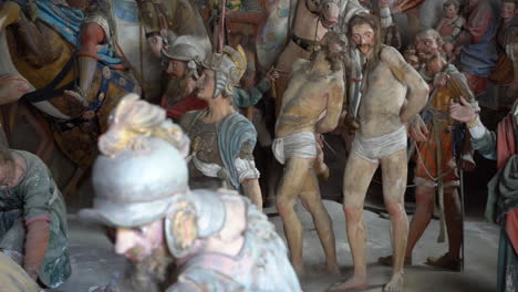 Terracotta-sculptures-of-Jesus-Christ-on-the-road-to-calvary-on-a-biblical-character-scene-representation-from-a-chapel-of-famous-Sacred-mountain-of-Varallo,-an-Unesco-world-heritage-site