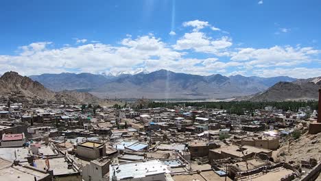 a-timelapse-of-white-clouds-moving-above-the-leh-central-city