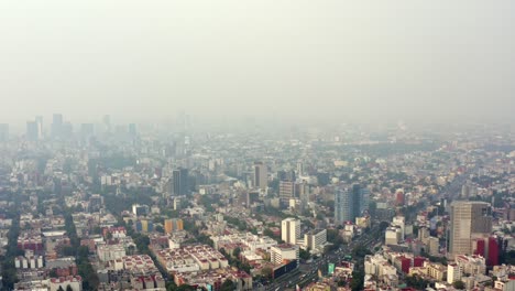 Aerial-wide-shot-of-the-skyline-of-Mexico-City-in-a-very-polluted-day