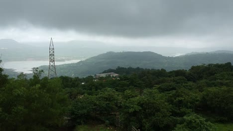 Road-trip-on-Indian-road-in-Monsoon---Rainy-season-seen-here-at-Dudhiware-Khind-at-Lonavala,-India---most-selling-stock-aerial-drone-footage