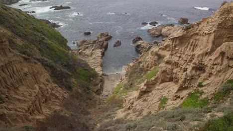 Drone-shot-moving-down-canyon-towards-the-Pacific-Ocean-on-the-California-Coast-near-Highway-One