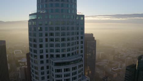 Beautiful-aerial-pan-around-downtown-Los-Angeles-building-during-sunrise