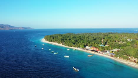 Idyllic-vacation-gateway-of-Indonesian-coastline-with-long-white-beaches-washed-by-calm-clear-water-of-turquoise-lagoon-in-the-middle-of-deep-blue-Andaman-sea