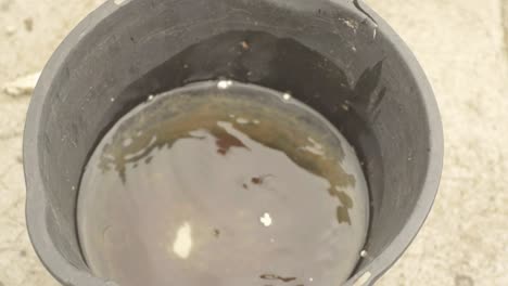 Bucket-catching-leaking-water-drops