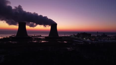 Static-Shot---Aerial-Drone-footage-of-a-Nuclear-Power-Plant-Cooling-Towers-are-Sunrise-with-steam-Winter