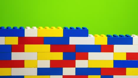 Stop-motion-transition-with-legos,-with-green-screen-in-the-background