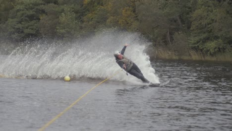Water-skier-slalom-ski-cuts-wide-around-buoy