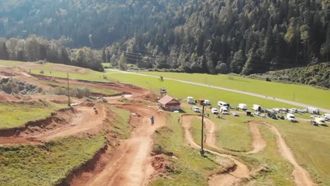 Drone-follow-shot-of-a-rider-on-a-motorbike-in-motocross-track