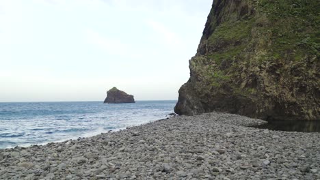 View-of-waves-crushing-into-the-rocky-beach-of-the-Arco-de-São-Jorge,-Santana,-Madeira-island,-Portugal