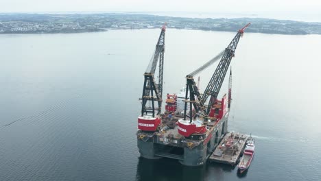 Aerial-View-of-Heavy-Lifting-Crane-Platform-and-Semi-Submersible-Vessel-in-Bay