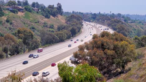Interstate-i805-at-Kearny-Mesa-facing-south-with-moderate-traffic-during-the-COVID-Pandemic,-High-angle-shot