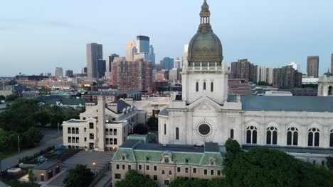 Aerial-view-of-Saint-Marys-chatedral-with-minneapolis-skyline-in-the-background-during-blue-hour