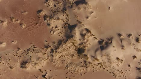 Aerial-view-of-sand-dune-textures-in-the-arid-region-of-the-Northern-Cape,-South-Africa