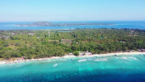 Lush-vegetation-of-tropical-islands-with-a-lot-of-villas-and-hotels,-perfect-location-for-holidays-in-Indonesia,-surrounded-by-blue-turquoise-sea