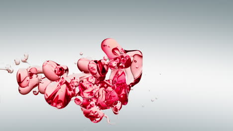 Burbujas-De-Aceite-Rojo-Transparente-Y-Formas-Fluidas-En-Agua-Purificada-Sobre-Un-Fondo-Degradado-Blanco