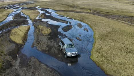 A-drone-video-following-a-modified-4x4-truck-in-the-highlands-of-Iceland
