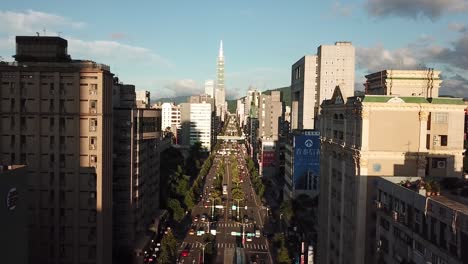 Xinyi-Road-Avenue-With-Overlook-on-Taipei-Tower,-Famous-Landmark-on-Taiwan,-Cinematic-Sunset-Aerial