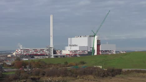 Rising-aerial-orbit-view-of-K3-Kemsley-power-Station-under-construction-in-Sittingbourne,-UK