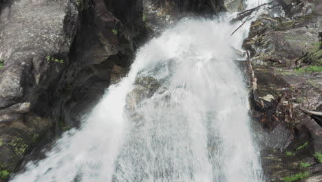 Aerial-tracking-shot-down-over-waterfall