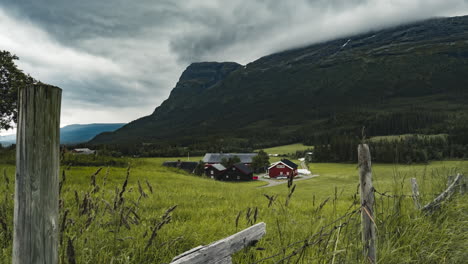 Farmhouse-Located-By-The-Mountainside-With-Sprawling-Green-Field-And-Magnificent-Views-In-Hemesdal-Norway---time-lapse-shot