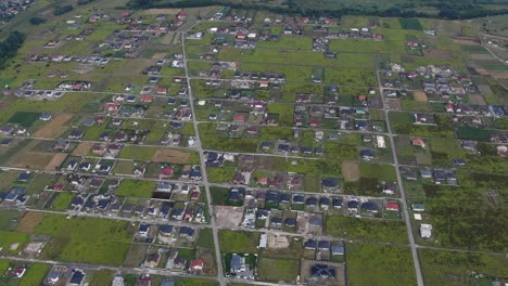 Aerial-View-of-Eastern-Europen-Neighborhood-With-Scattered-Houses-and-Fields