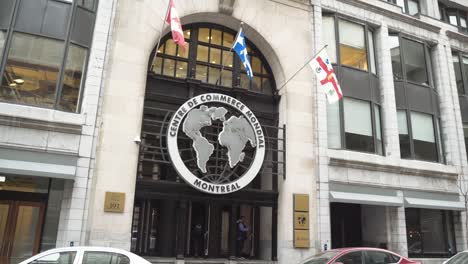 One-of-the-front-entrances-to-the-World-Trade-Center-Montreal-Centre-De-Commerce-Mondial-building-with-French-Canadian-Flags