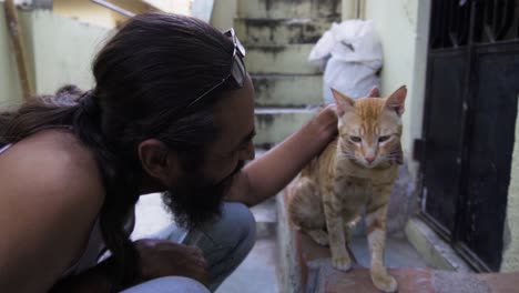 Beard-Man-with-Indian-billi-breed-also-known-as-Indian-common-cat
