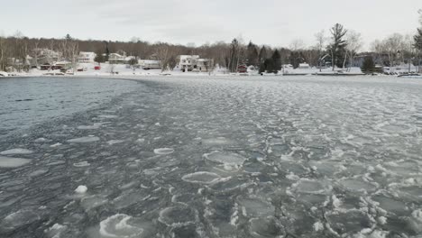 Ice-sheets-ripple-with-waves-across-lake-surface