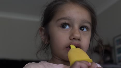 Four-Year-Old-UK-Asian-Girl-Licking-And-Sucking-On-Ice-Lolly
