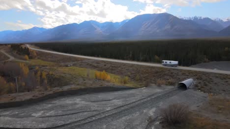 Caravan-driving-on-Alaska-Highway,-Kluane-National-Park,-British-Columbia